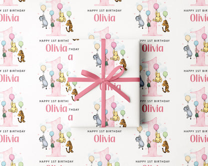 The image is a repeating pattern of a pink gift box with a bow, featuring illustrations of Winnie the Pooh and other characters, along with the text "Happy 1st Birthday Olivia" and "Happy 1st Birthday" written on it.